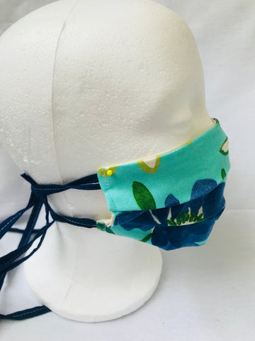 Pleated double ply green blue floral face covering with tie backs or elastic ear loops